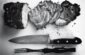 grayscale photo of grilled meat beside knife and fork
