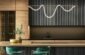 a modern kitchen with a bar and stools