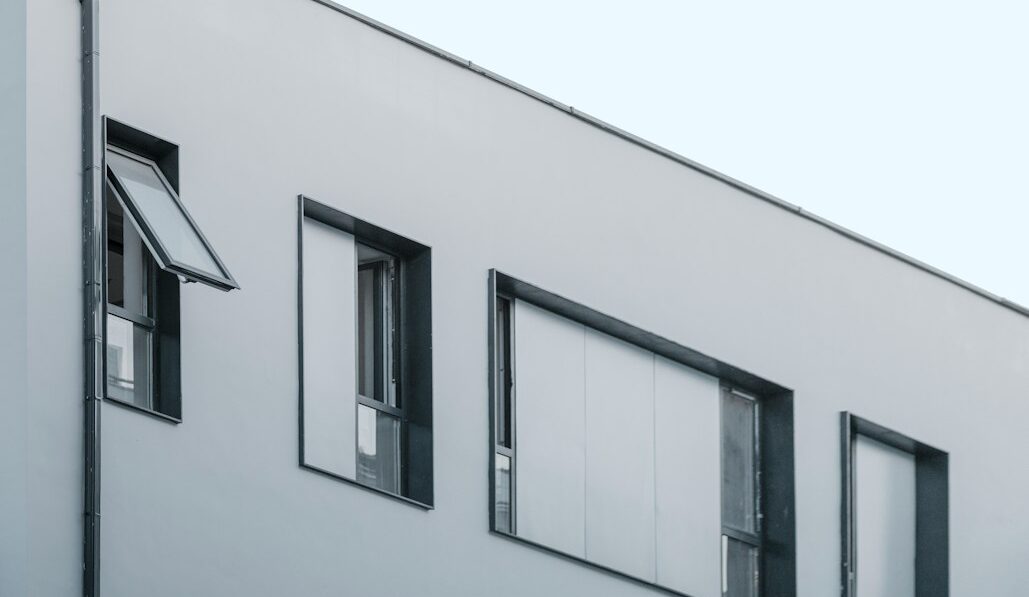 gray concrete building under clear blue sky