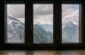 fogs covered snow capped mountain range view outside window