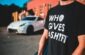 man in black crew neck t-shirt standing on road during daytime