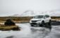 white Honda SUV on gray floor