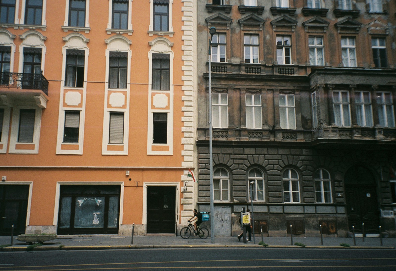 a building with a person riding a bicycle